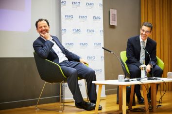 Image of speaker Luigi Zingales sitting down with chair Dimitri Vayanos at the Inaugural Sir Oliver Hart Lecture organised by the Financial Markets Group at the LSE.
