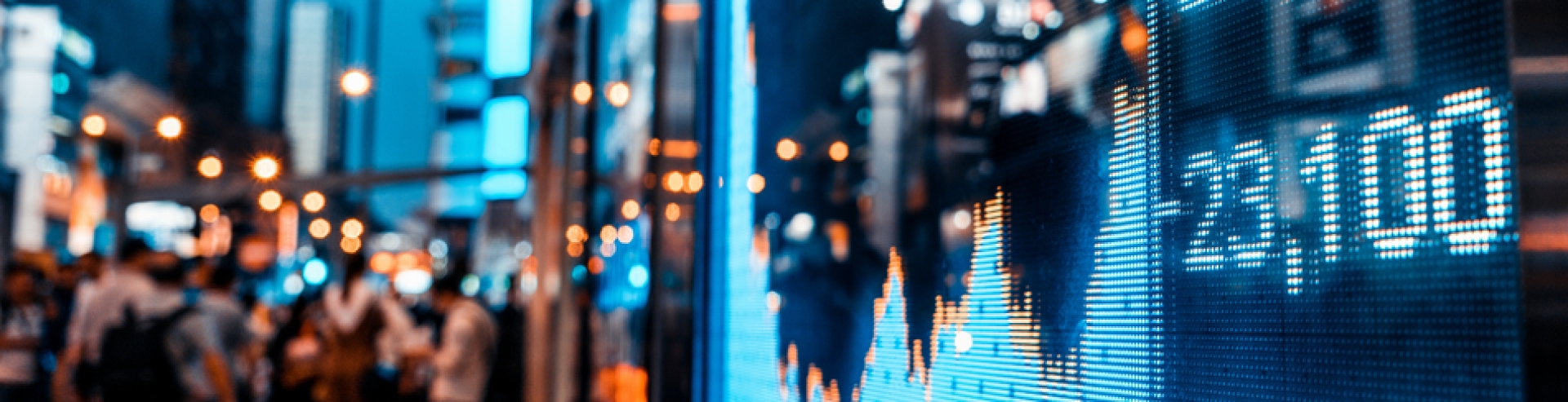 Display of Stock market quotes with city scene reflect on glass