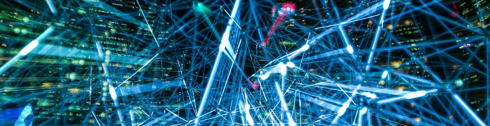 glowing network in front of city skyscrapers