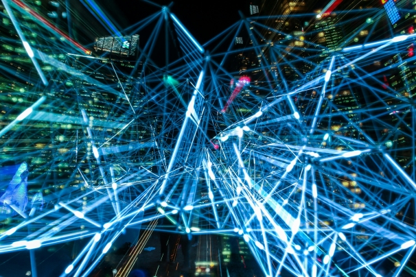 glowing network in front of city skyscrapers