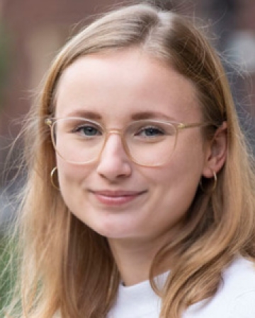 Photo of Paula Patzelt - Caucasian woman, blonde with blue eyes, wearing glasses