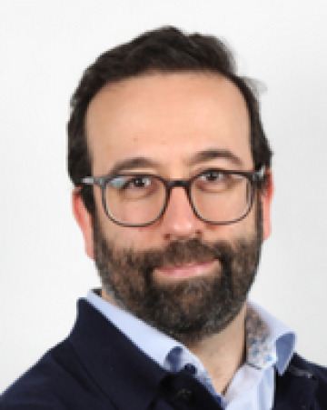 Profile photo of Ricardo Reis, white male, dark hair, dark eyes, wearing beard and glasses